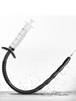 Silicone dilator with holes and syringe